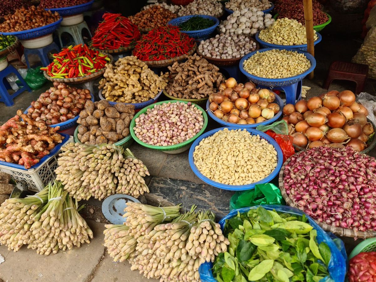 Baskets of fresh vegetables, chillies and spices at a market in Hanoi, Vietnam